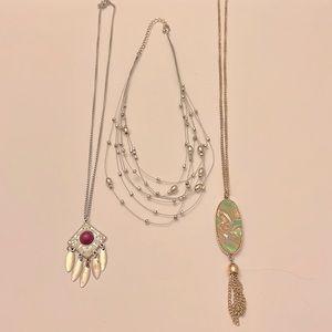 Girl’s costume jewelry bundle of three necklaces shown in photos.